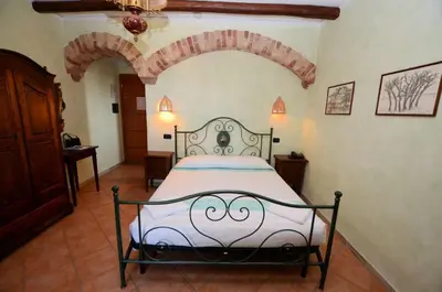 Letto o letti in una camera di Su Canonigu Agriresort - Rooms & Glamping