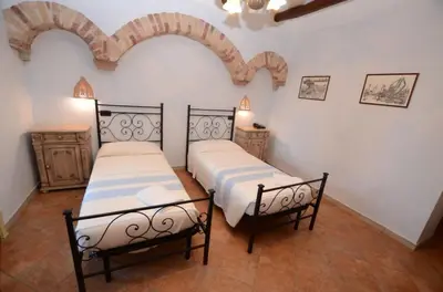 Letto o letti in una camera di Su Canonigu Agriresort - Rooms & Glamping