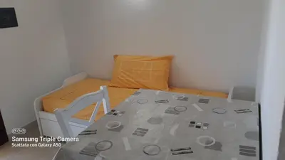 Letto o letti in una camera di Bilocale in centro