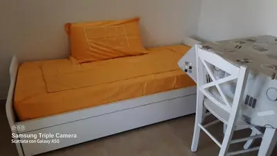 Letto o letti in una camera di Bilocale in centro