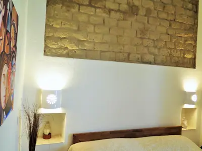 Letto o letti in una camera di B&b-Le Rondini
