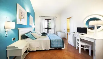 Letto o letti in una camera di iGV Club Santagiusta