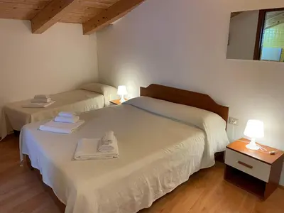Letto o letti in una camera di Domo Is Solus - Affittacamere - Living Sant'Antioco