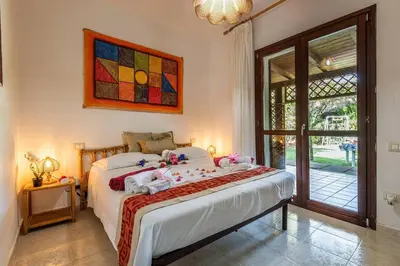 Letto o letti in una camera di Una Pineta Sul Mare A Due Passi Dal Forte Village