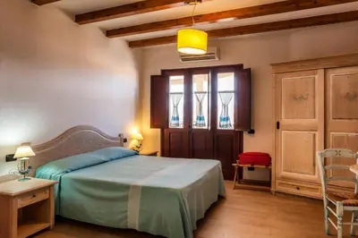 Letto o letti in una camera di Residenza Petrera