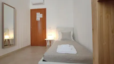 Letto o letti in una camera di Nell'Azzurro