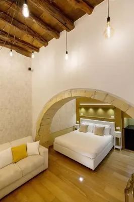 Letto o letti in una camera di Martini Castello Boutique Rooms