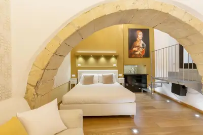 Letto o letti in una camera di Martini Castello Boutique Rooms