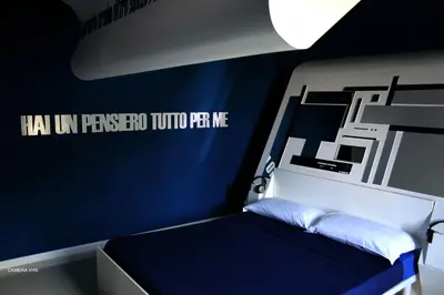 Letto o letti in una camera di Diecizero Affittacamere