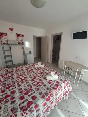 Letto o letti in una camera di B&B Metalla