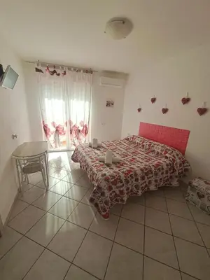 Letto o letti in una camera di B&B Metalla