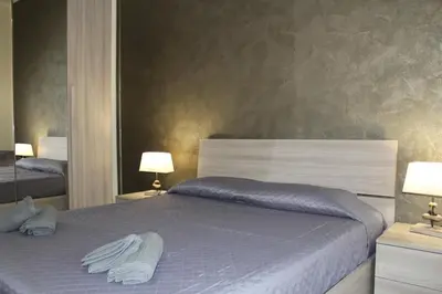 Letto o letti in una camera di Cagliari 4u