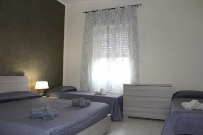 Letto o letti in una camera di Cagliari 4u