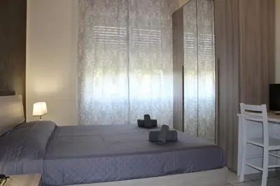 Letto o letti in una camera di Cagliari 4u