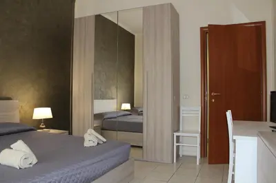Letto o letti in una camera di Cagliari 4u