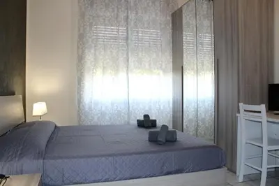 Letto o letti in una camera di Cagliari 4u