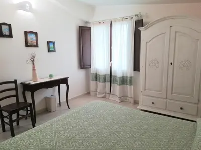Letto o letti in una camera di S'eredeu Apartments