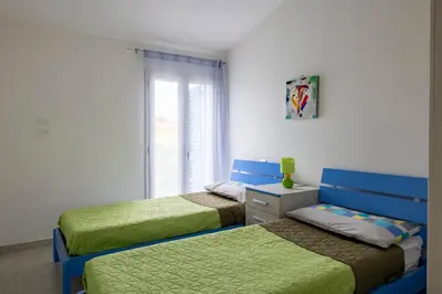 Letto o letti in una camera di casa romy