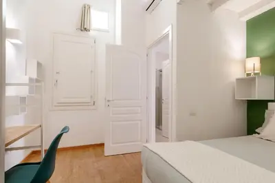 Letto o letti in una camera di Domus de Silva - Appartamento in centro storico a Cagliari