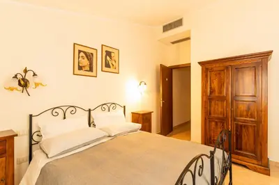 Letto o letti in una camera di Agriturismo Il Giglio