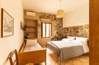 Letto o letti in una camera di Agriturismo Il Giglio