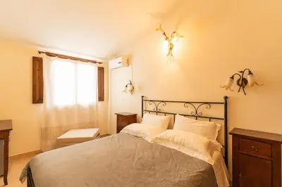 Letto o letti in una camera di Agriturismo Il Giglio