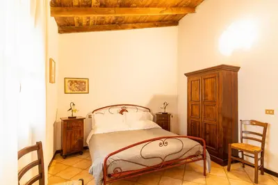 Letto o letti in una camera di Agriturismo Il Giglio