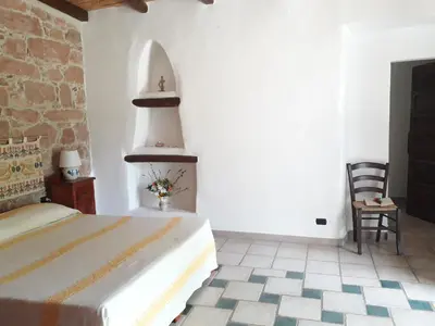 Letto o letti in una camera di Sa Perda Arrubia