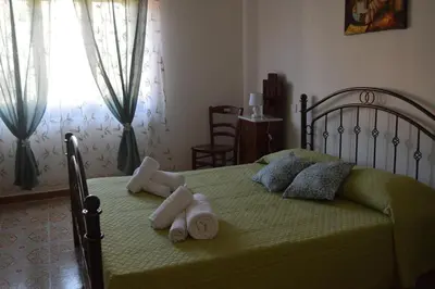 Letto o letti in una camera di Su Fassoi Cabras