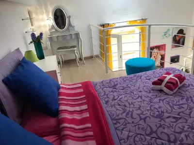 Letto o letti in una camera di Loft delizioso