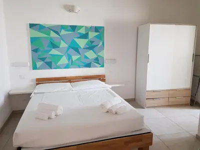 Letto o letti in una camera di B. SINIS