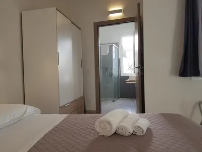 Letto o letti in una camera di B. SINIS