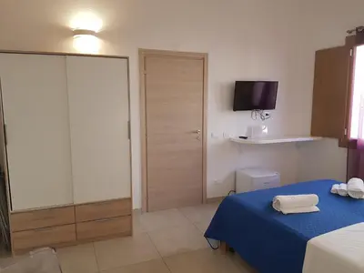 Letto o letti in una camera di B. SINIS