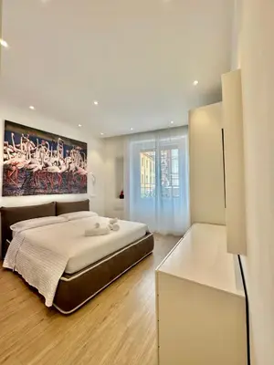 Letto o letti in una camera di CeO LUXURY SUITE DI CAGLIARI