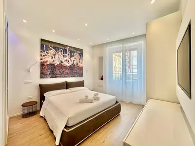Letto o letti in una camera di CeO LUXURY SUITE DI CAGLIARI