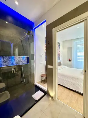 Letto o letti in una camera di CeO LUXURY SUITE DI CAGLIARI