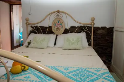 Letto o letti in una camera di B&B Martina