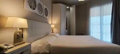 Letto o letti in una camera di Hotel Palladium