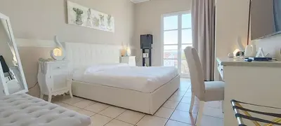 Letto o letti in una camera di Hotel Palladium