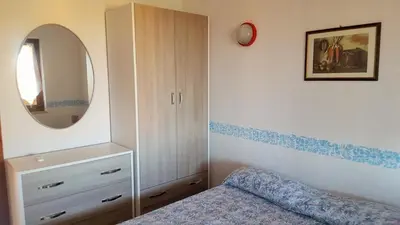 Letto o letti in una camera di Villetta Amare Sardegna