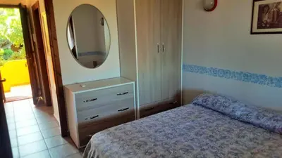 Letto o letti in una camera di Villetta Amare Sardegna