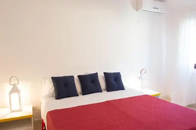Letto o letti in una camera di Terrazze di Chia