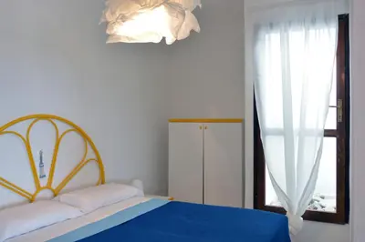 Letto o letti in una camera di Terrazze di Chia