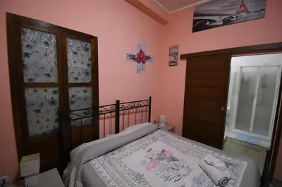 Letto o letti in una camera di b&b del corso