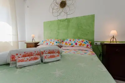 Letto o letti in una camera di Bellavista