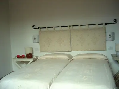Letto o letti in una camera di Guest House Il Giardino Segreto