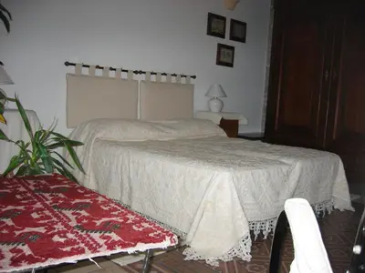 Letto o letti in una camera di Guest House Il Giardino Segreto