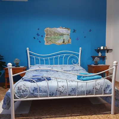 Letto o letti in una camera di B&B Da Andreina