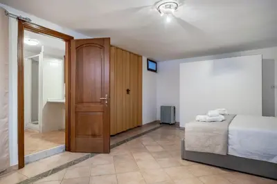 Letto o letti in una camera di Villa Ornella - 3 bagni, giardino, mare a 1 minuto