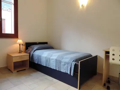 Letto o letti in una camera di la casetta rosa